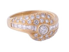 A diamond ring, the central brilliant cut diamond in a collet setting within... A diamond ring, the