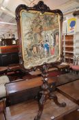 A Victorian rosewood polescreen with inset needlework panel 130cm high, 61cm wide