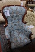 A William IV mahogany framed button back upholstered armchair