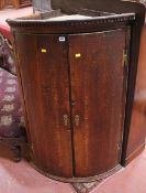 A George III oak bow front corner cupboard 124cm high  Best Bid