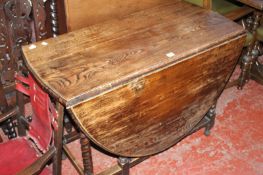 A 17th Century oak gateleg table 76cm high, 107cm wide