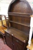 A reproduction oak dresser with arched platerack 188cm high, 92cm wide and five armchairs Victorian