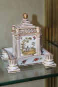 A Dresden porcelain square cup and pierced cover with associated saucer; decorated with flowers and