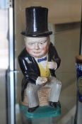 A Kirklands `Embassy Ware` character jug modelled as Sir Winston Churchill; 26cm high, together