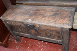 An 18th Century oak coffer. with twin lozenge carved panelled front 68cm high, 113cm wide