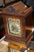 A Victorian carved oak quarter-striking bracket clock, late 19th century, the two train eight-day