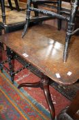 A Georgian oak square snap-top table on a tripod base 72cm high, 66cm wide