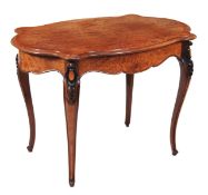 A Victorian amboyna and hardwood centre table, circa 1870, the quarter veneered serpentine top