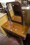 A Victorian mahogany dressing table with fitted mirror 135cm high, 90cm wide  Best Bid