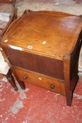 A George III mahogany bedside commode with a tambour door 72cm high, 56cm wide