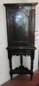 A Victorian oak carved corner cupboard on stand 193cm high, 69cm wide