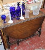 A gateleg table, mixed glassware, small selection of dolls and various books (this lot is being