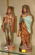 A pair of Austrian terracotta figures; 33cm high Best Bid