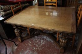 An Elizabethan style oak draw leaf oak table on bulbous carved legs joined by stretchers 77cm high,