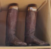 A pair of vintage riding boots with wooden trees Best Bid