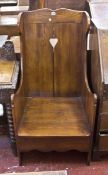 An oak wing armchair