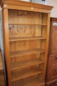 A modern pine bookcase 198cm high, 100cm wide  Best Bid