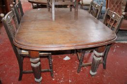 A Victorian mahogany dining table with a moulded top on bulbous reeded legs 70cm high, 142cm length