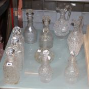 Two pairs of cut glass decanters, a pair of cut glass ewers/jugs with matching goblet and four
