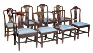 A matched set of eight mahogany dining chairs, including four armchairs and four side chairs, with