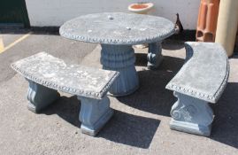 A composition stone table 73cm high, 121cm length and three shaped benches.