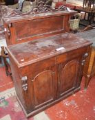 A Victorian mahogany chiffonier with a pierced galleried superstructure and arched doors below