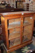 A small glass fronted wall hanging bookcase 70cm high, 64cm wide  Best Bid