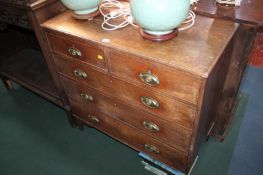 A George III oak chest of two short and three long drawers and a mahogany side chair