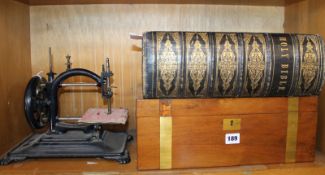 A large late 19th Century family Bible, a brass bound writing slope and sewing machine