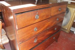 A George III mahogany chest of drawers, circa 1790, the rectangular top with stringing two short