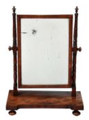 A George IV mahogany dressing table mirror, circa 1825, the rectangular plate flanked by turned
