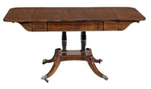 A Regency rosewood and brass strung sofa table, circa 1815, the rectangular top incorporating a