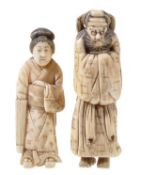 A Japanese walrus ivory okimono of a standing figure of a woman, she holds a furled parasol in one