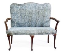 A George II walnut settee, circa 1750, with a rectangular padded back, above open arms and a padded