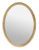A carved giltwood and composition oval wall mirror, in George III style, of recent manufacture, the