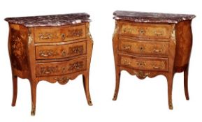 Two similar rosewood, tulipwood and gilt metal mounted serpentine commodes, in Louis XV style, late