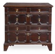 A Charles II oak chest of drawers, circa 1660, the rectangular top above two short and two long