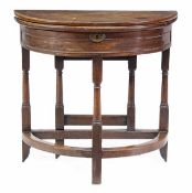 A walnut semi-elliptical folding tea table, circa 1700, the hinged top opening to a plain interior