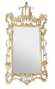 A carved giltwood wall mirror, in George III style, 20th century, the rectangular plate within a