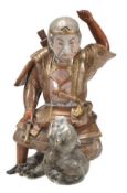 A Hirado porcelain model of Il no Hayata slaying the Nue, the armoured warrior stands astride the