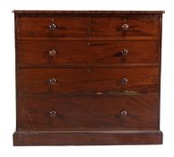 A Victorian mahogany chest of drawers, circa 1860, stamped Holland and Sons, the moulded