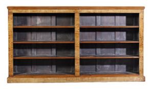 A pollard oak and marquetry open bookcase, circa 1860 and later, the rectangular top above an