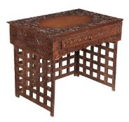 A Chinese carved and stained hardwood travelling desk, late 19th century, the rectangular top with a