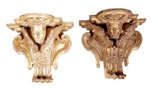 A pair of giltwood wall brackets, in 18th century style, carved with relief with a winged mask and s