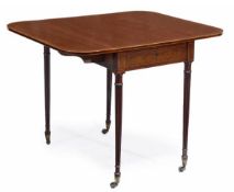 A Regency mahogany Pembroke table, circa 1815, the rectangular top incorporating a pair of hinged