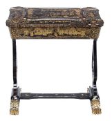 A Chinese Export black lacquer and gilt decorated work table, circa 1870, the shaped rectangular