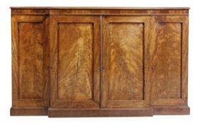 A Regency mahogany breakfront cabinet, 1815, with a pair of central cupboard doors flanked on