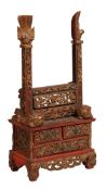 A Chinese painted and parcel gilt stand, late 19th/early 20th century, carved profusely throughout w