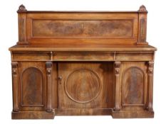 A Victorian mahogany sideboard, circa 1870, with a rear panelled gallery, the base with three