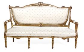 A Victorian giltwood framed and upholstered settee, circa 1880, the shaped overstuffed back